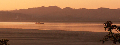 Boat on Ayeyarwaddy with Tent Kyi hill in background